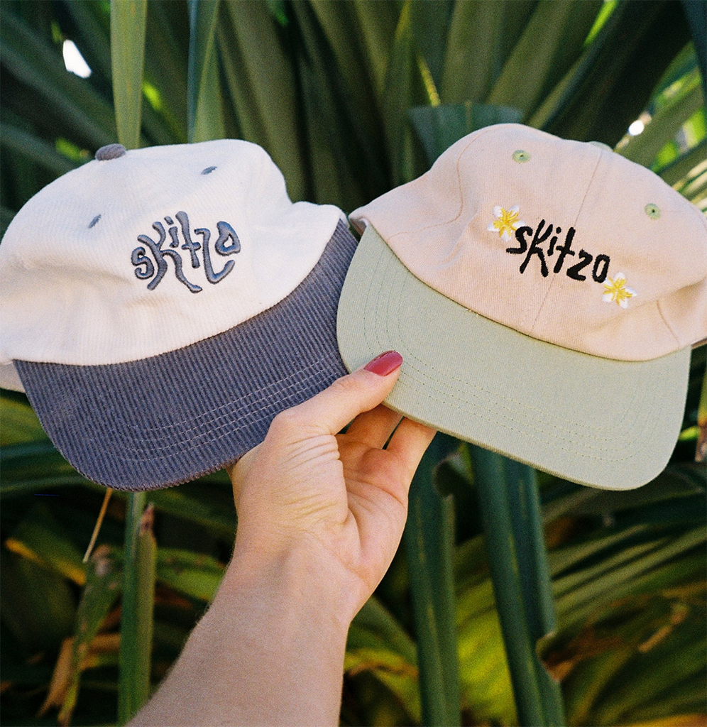 two tone surf lid caps, blue and white corduroy with skitzo embroidery and green and cream cotton with frangipani embroidery